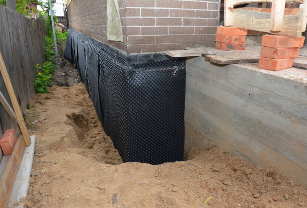 SJ Waterproofing Pros technician performing targeted Foundation Crack Repair assessment in Greentown, OH